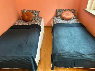 Łóżko lub łóżka w pokoju w obiekcie Domek w Lesie