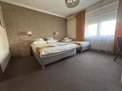 Łóżko lub łóżka w pokoju w obiekcie Pasja Noclegi B&B