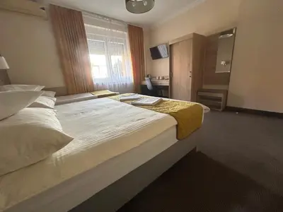 Łóżko lub łóżka w pokoju w obiekcie Pasja Noclegi B&B