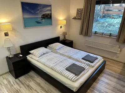 Łóżko lub łóżka w pokoju w obiekcie Willa Bukówka Dom całoroczny w górach nad jeziorem z jacuzzi i sauną