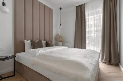Łóżko lub łóżka w pokoju w obiekcie APARTIO ROOMS Gliwice