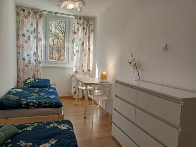 Łóżko lub łóżka w pokoju w obiekcie Lemuria Jawor pokoje