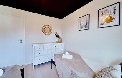 Łóżko lub łóżka w pokoju w obiekcie LAGUNA Villa Fonte 4