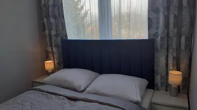 Łóżko lub łóżka w pokoju w obiekcie Apartament Kotlina