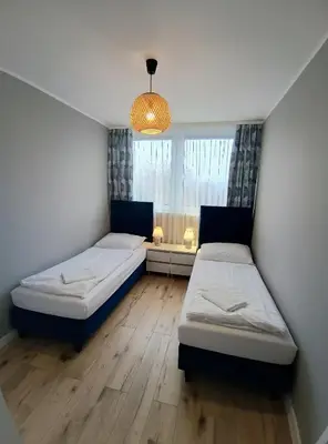 Łóżko lub łóżka w pokoju w obiekcie Apartament Kotlina