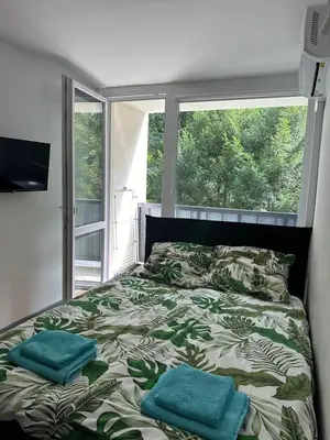 Łóżko lub łóżka w pokoju w obiekcie Apartament 220 na Park Leśny