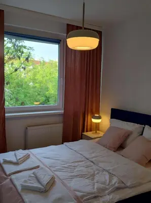 Łóżko lub łóżka w pokoju w obiekcie Tabago Studio 8