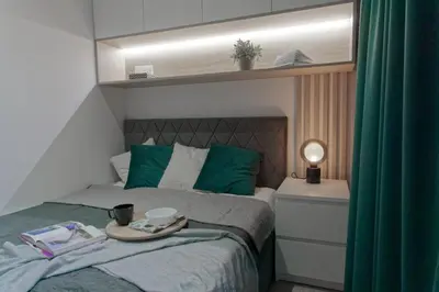 Łóżko lub łóżka w pokoju w obiekcie Green Oasis Apartment - City Center - Free Parking - Self check-in