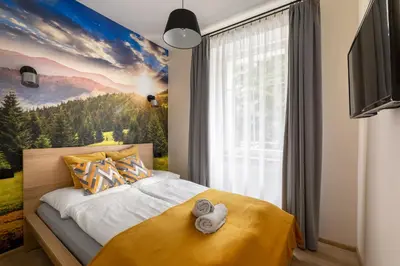 Łóżko lub łóżka w pokoju w obiekcie Apartament U Góralki