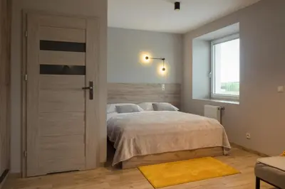 Łóżko lub łóżka w pokoju w obiekcie Pokoje Pod Brzozą
