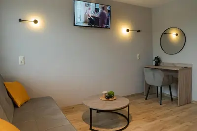 Telewizja i/lub zestaw kina domowego w obiekcie Pokoje Pod Brzozą
