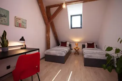 Łóżko lub łóżka w pokoju w obiekcie Apartament 