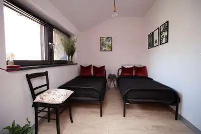Łóżko lub łóżka w pokoju w obiekcie Apartament 