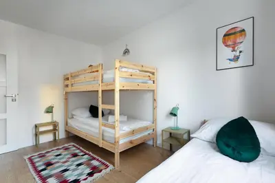 Łóżko lub łóżka w pokoju w obiekcie Zakątek Kudowa Rodzinny