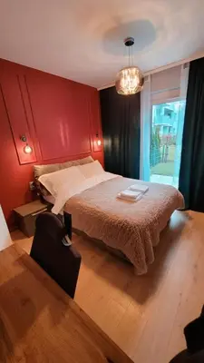 Łóżko lub łóżka w pokoju w obiekcie Green Terrace Big Family Apartment
