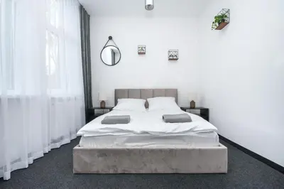 Łóżko lub łóżka w pokoju w obiekcie Apartamenty Zabrska 45