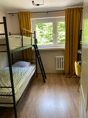 Łóżko lub łóżka w pokoju w obiekcie Apartament w Zdroju