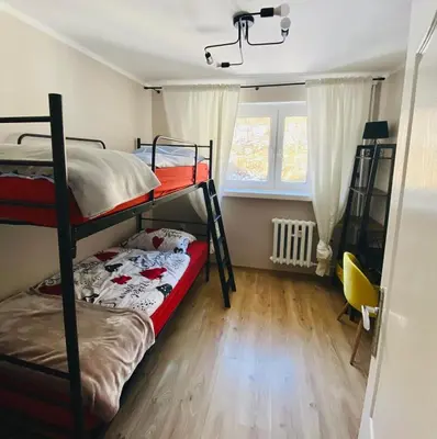 Łóżko lub łóżka w pokoju w obiekcie Apartament w Zdroju