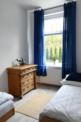Łóżko lub łóżka w pokoju w obiekcie Apartament Niezapominajka